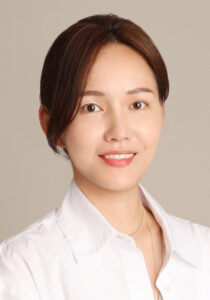 Smiling woman in white blouse